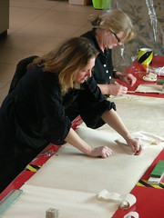 Conservators working on the Bayeux Tapestry photograph, February 2009.