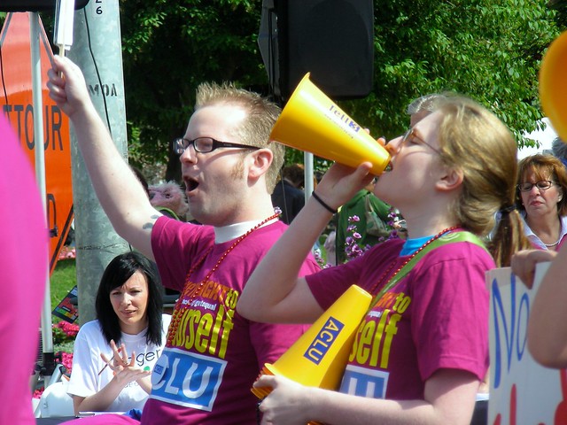 John Aronno and Heather James marching with ACLU & Equality Works