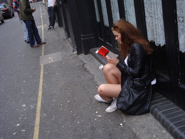 Woman reading on the street-2