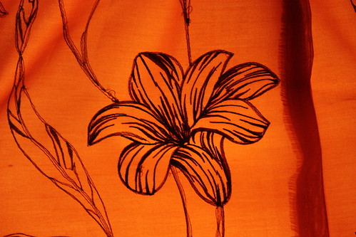 Black flower on orange background 
