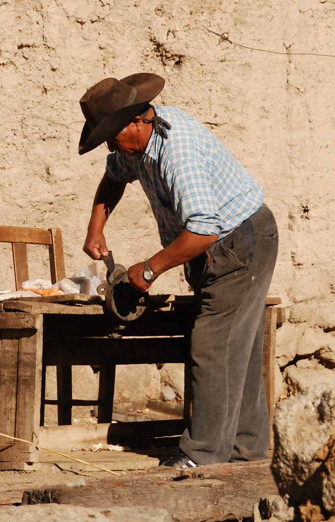 Sharpening a knife, the old fashioned way, Tastil, Argentina
