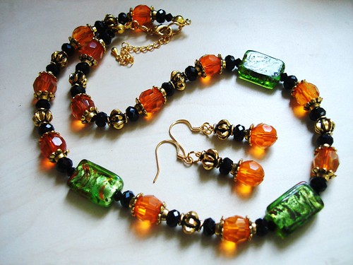  #GBN087+E = ALWAYS SWEET  Glass Beaded Necklace N+E Set $35 = Green Foil  Glass Beads , Tangerine Orange Czech Glass Beads , Black Rondelles and Antique Gold Plated Metal Findings. Necklace measure about 16-18" in lenght with 2 " extension chain / earrings Approx about 4-5cms including hooks.