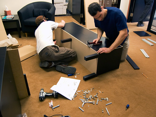 Other People Assembling Office Furniture