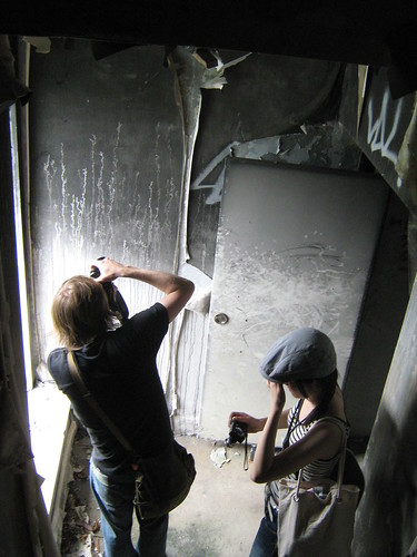 Lady friend and Niklas snapping photos of peeling wallpapers