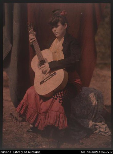 His wife, Jean, posing with guitar (1906).