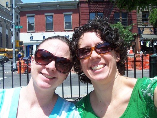 melissa and waldie sitting at father demo square in the west village, nyc