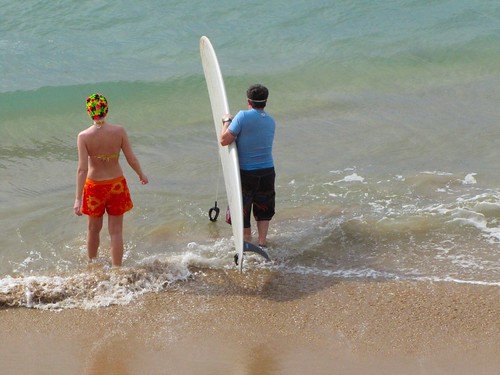 the dynamic surfing duo enters the water