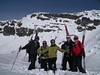 A group of skiers takes a moment for a picture at the top of Chapelco