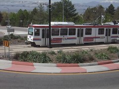TRAX passing east through roundabout (2nd view)