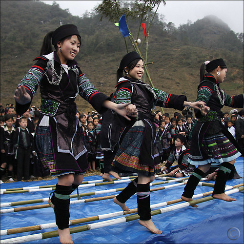 Hmong dancing over clapping Bamboo by NaPix -- Hmong Soul.