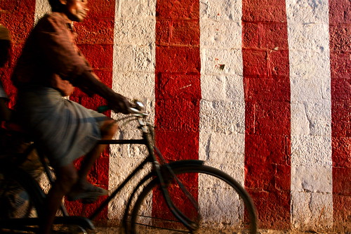Cycling past a temple, Tiruchirapalli