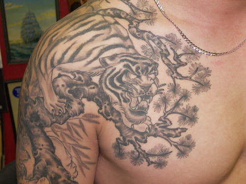 black and grey tiger in tree tattoo chinese style