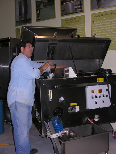 Rea demonstrates how oil is extracted from olives