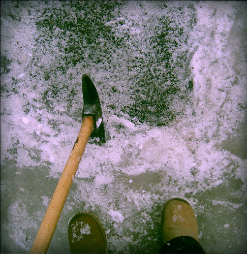 Me Chopping Ice in Driveway