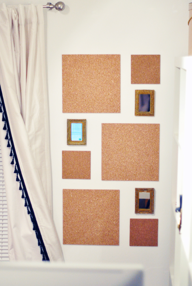 cork wall tiles with small gold framed mirrors