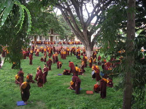 Debate on the cool, grassy lawn of Namdroling Monastery