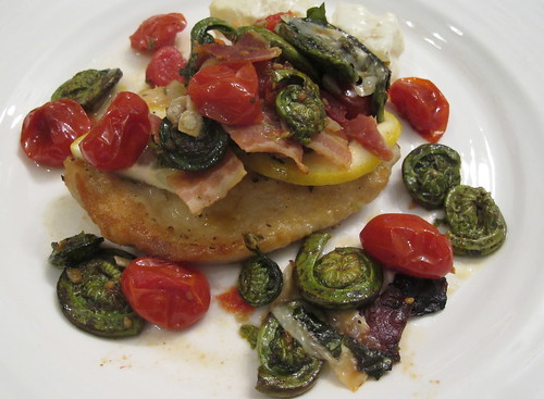 Chicken picatta topped with fiddlehead ferns and tomatoes