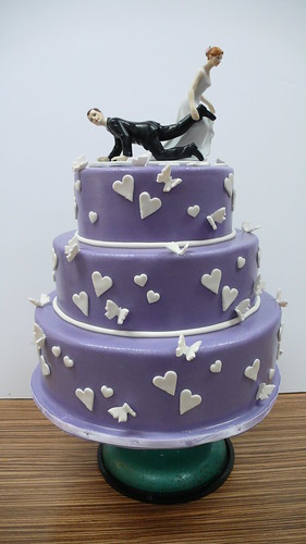 Purple Wedding Cake with white hearts and butterflies