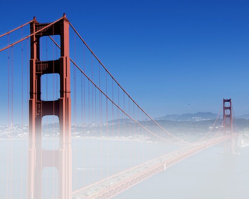 golden gate bridge fog. Fog Over Golden Gate Bridge. Fog rolls in over the Golden Gate