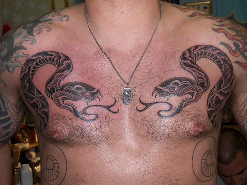 snakes tattoo. symetrical snakes tattoo