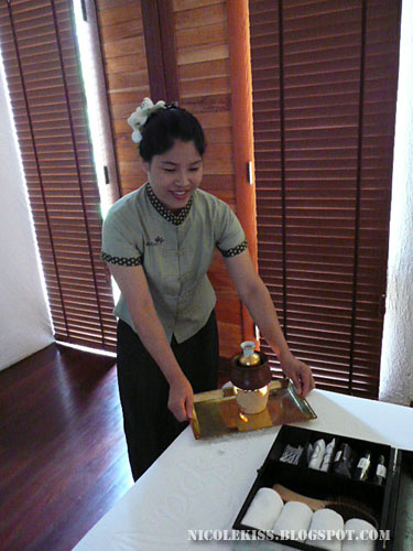 massuer preparing massage oil