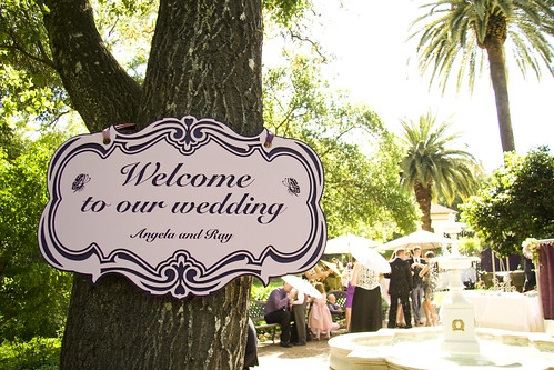  some fun wedding signs and photo props for an Alice in Wonderland theme