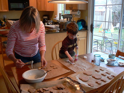 Mom and Davey decorate cookies