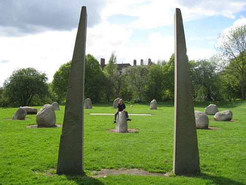 view through two stone pillars to standing stone circle