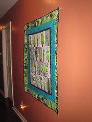 The tree quilt hangs in our hallway..