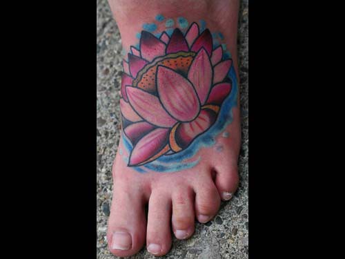 Flower Tattoo With Piercing. Lotus Flower tattoo