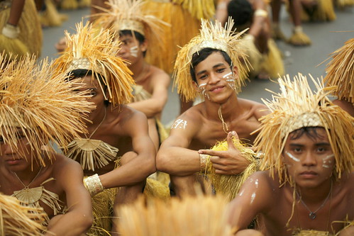 a contingent in grass costumes