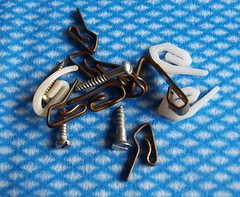 Assorted screws and picture and curtain hooks