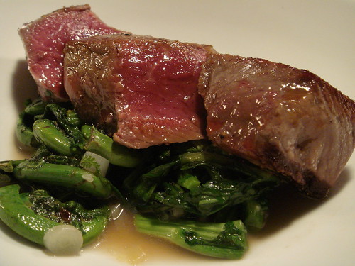 entrecôte of beef with fiddleheads and sautéed wild greens