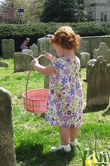 Speck with flowered dress and Easter basket, in church yard