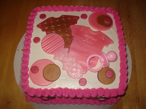 Baby girl onzies baby shower cake-$45.00 www.charleyandthecakefactory.com 