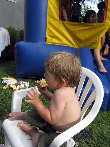 Little boy enjoying a cupcake