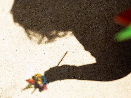 shadow of child with pinwheel 