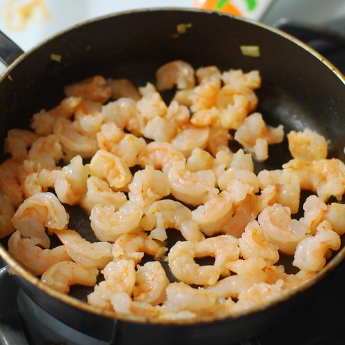 Lightly sauteing the shrimps.
