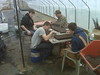 Kay and the boys planting veggie seeds, Local Matters!