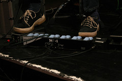 Photo of Steve Lawson's feet, operating a looperlative, at a Recycle Collective gig. Photo taken by Steve Brown