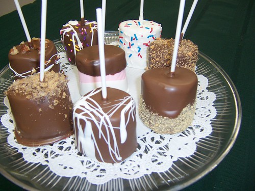 Giant marshmallows, dipped in chocolate and other toppings.