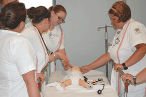Health care students in Georgia work with a human patient simulator funded by USDA through the Recovery Act.