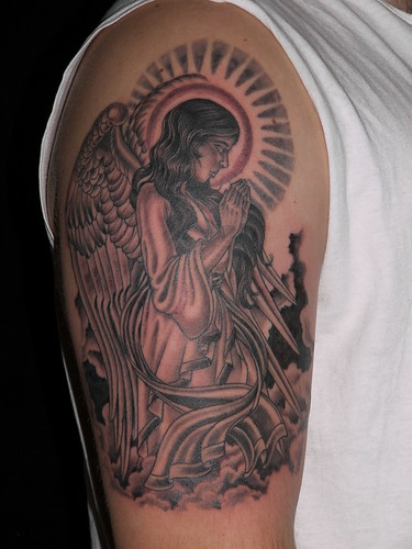 black and grey angel and clouds tattoo upper arm
