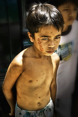 Cutud, Pampanga - Boy who carried the whip for a self-flagellation man on Easter day by Mio Cade