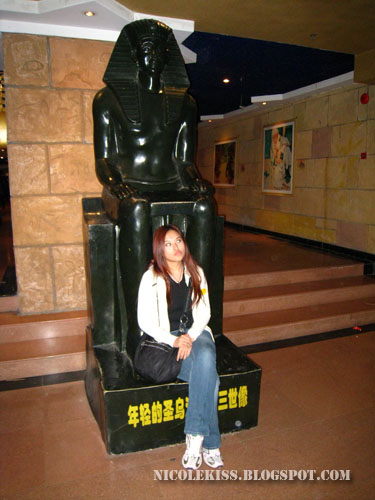 sitting on egyptian statue