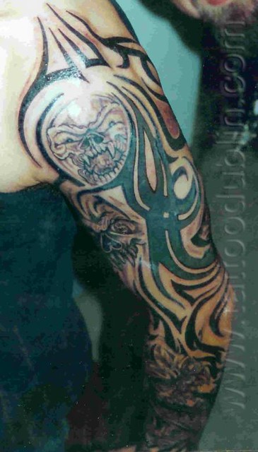 skull tribal tattoo sleeve by dublin ireland tattoo artist 'Pluto'