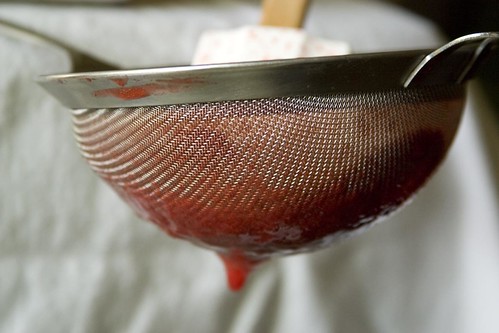 Straining strawberry puree