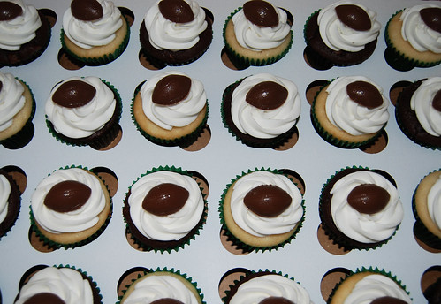 football cupcakes with green liners for a 7th birthday party