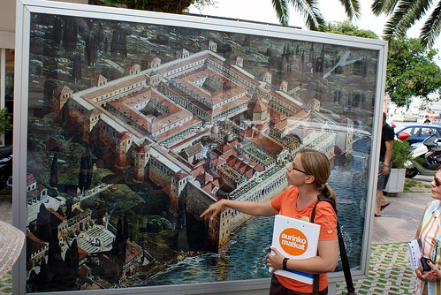The guide explains the palace map in Split