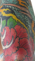 tatoo on elbow of red peony